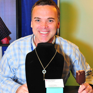 Michael displays a Tiffany & Co. necklace at the 2012 ASPR conference