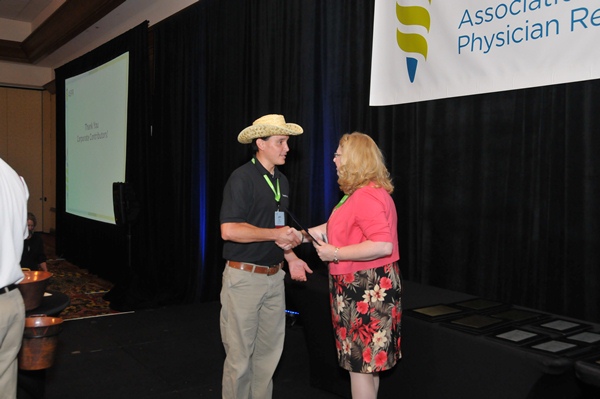 CompHealth's Jeff accepts the ASPR coprorate contributor recognition