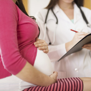 OB/GYN visiting with pregnant patient