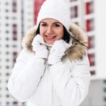 Beautiful young woman outdoors in winter