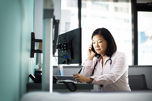 Physician on the phone with a recruiter