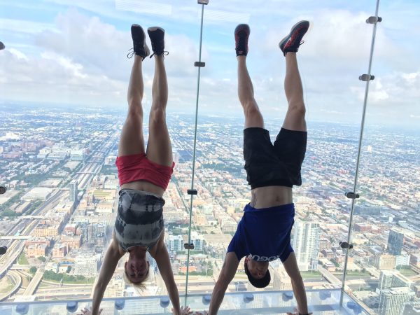 CompHealth Allied - travel therapy lifestyle - image of Michelle and Cameron Moore enjoying free time handstands during an assignment