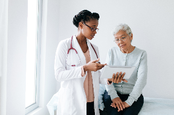 Physician speaking with patient