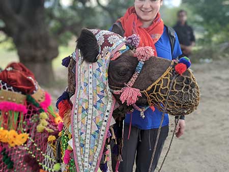Woman and a camel in India