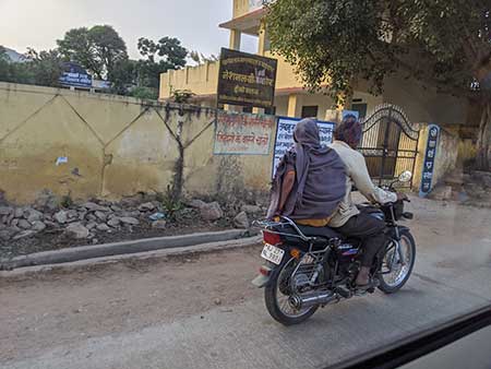 Man and woman on motorcycle in India