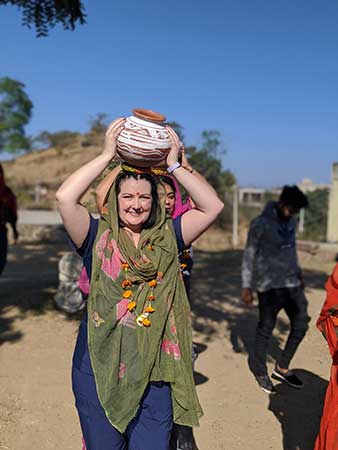 Woman in India holding a pot on her head