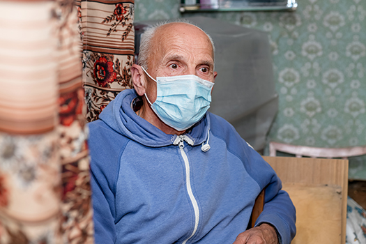 Older rural man wearing a mask