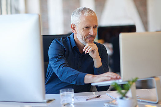 Physician on laptop earning CMEs