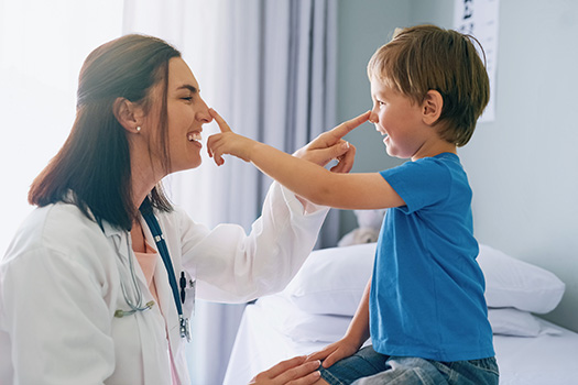 Pediatric physician seeing a small child