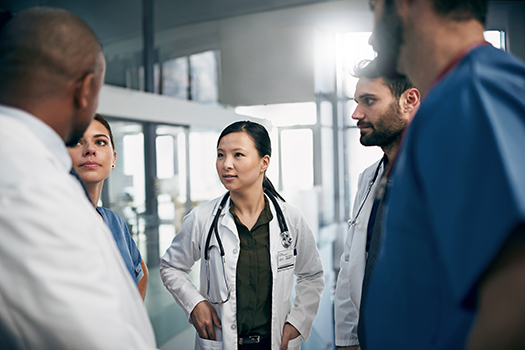 Shot of a diverse team of doctors having a discussion