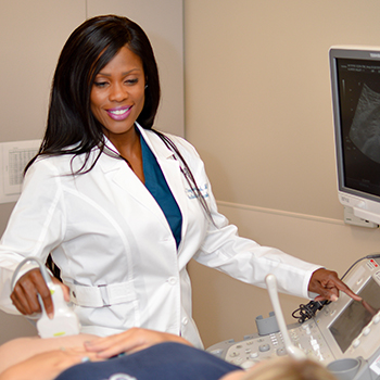 Dr. Shyrlena Bogard performing an ultrasound