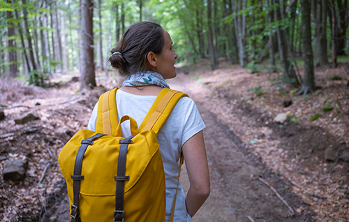 Female physician hiking in woods