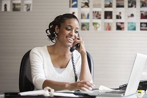 Woman on phone working toward a future-ready healthcare workforce