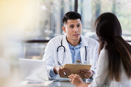 Physician in his first job talking to patient